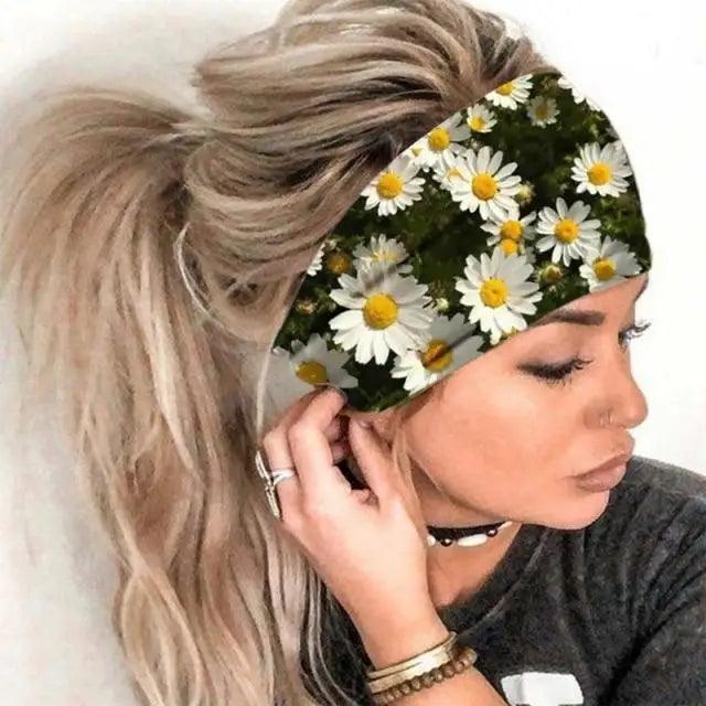 Woman wearing a headband with daisy pattern on a white background