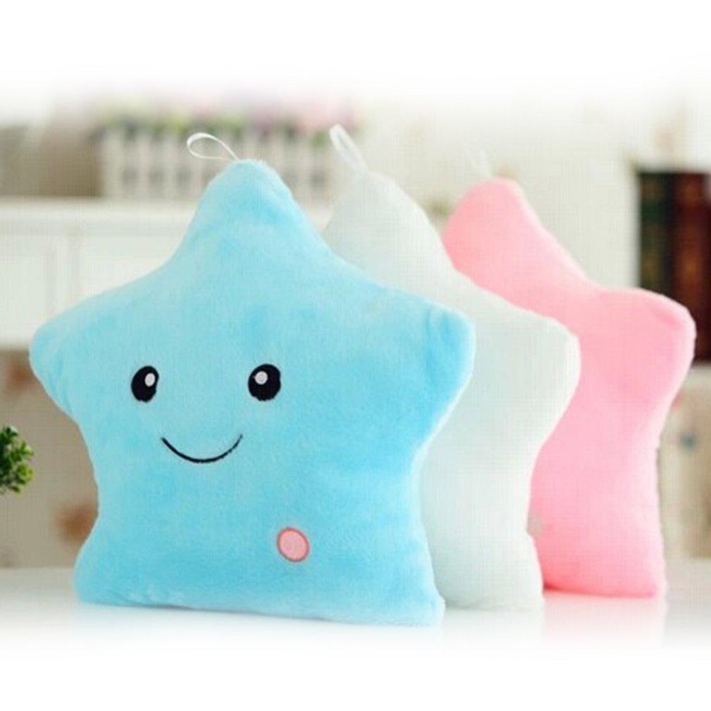 Two star-shaped plush toys, one blue and one pink, on a white surface with a blurred background.