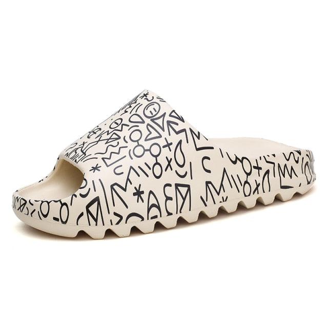 White sandal with black abstract patterns on a white background