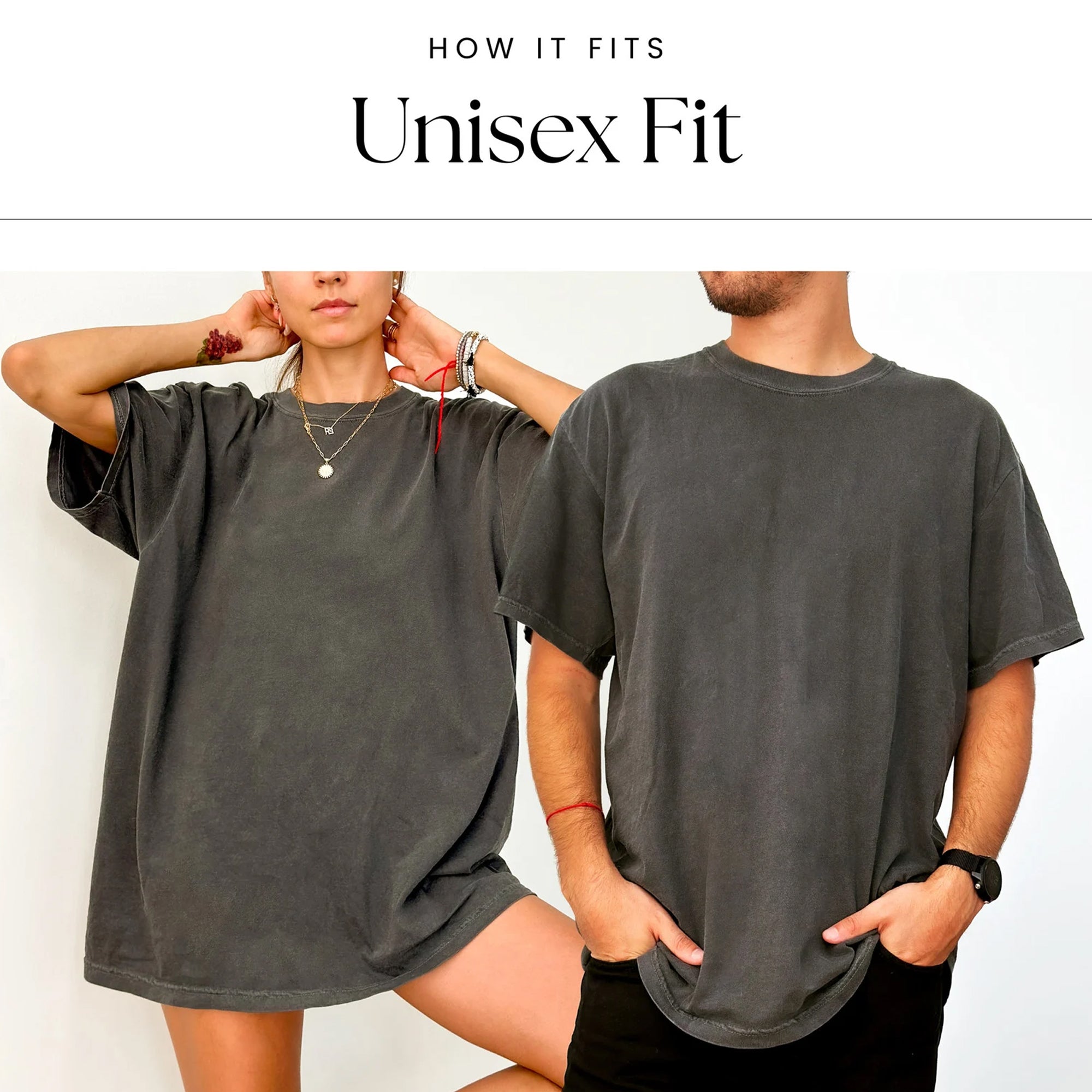 Two people wearing gray oversized t-shirts with text indicating 'Unisex Fit'.