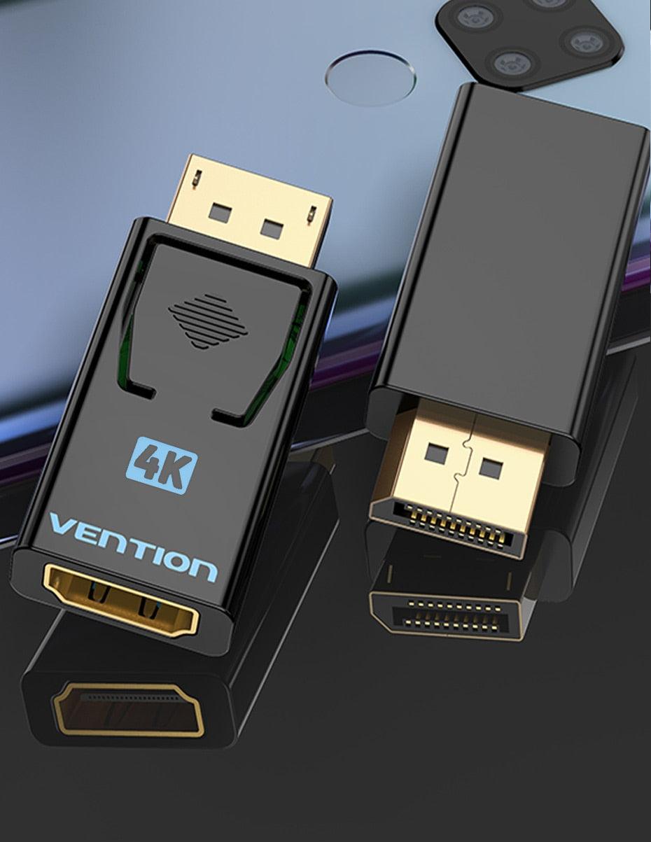 HDMI connectors with Vention branding on a reflective surface