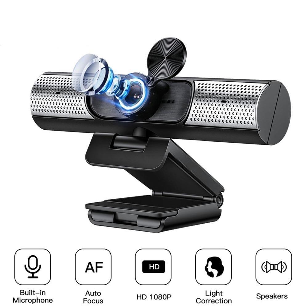 Webcam with built-in microphone, auto focus, HD 1080P resolution, light correction, and speakers on a white background.