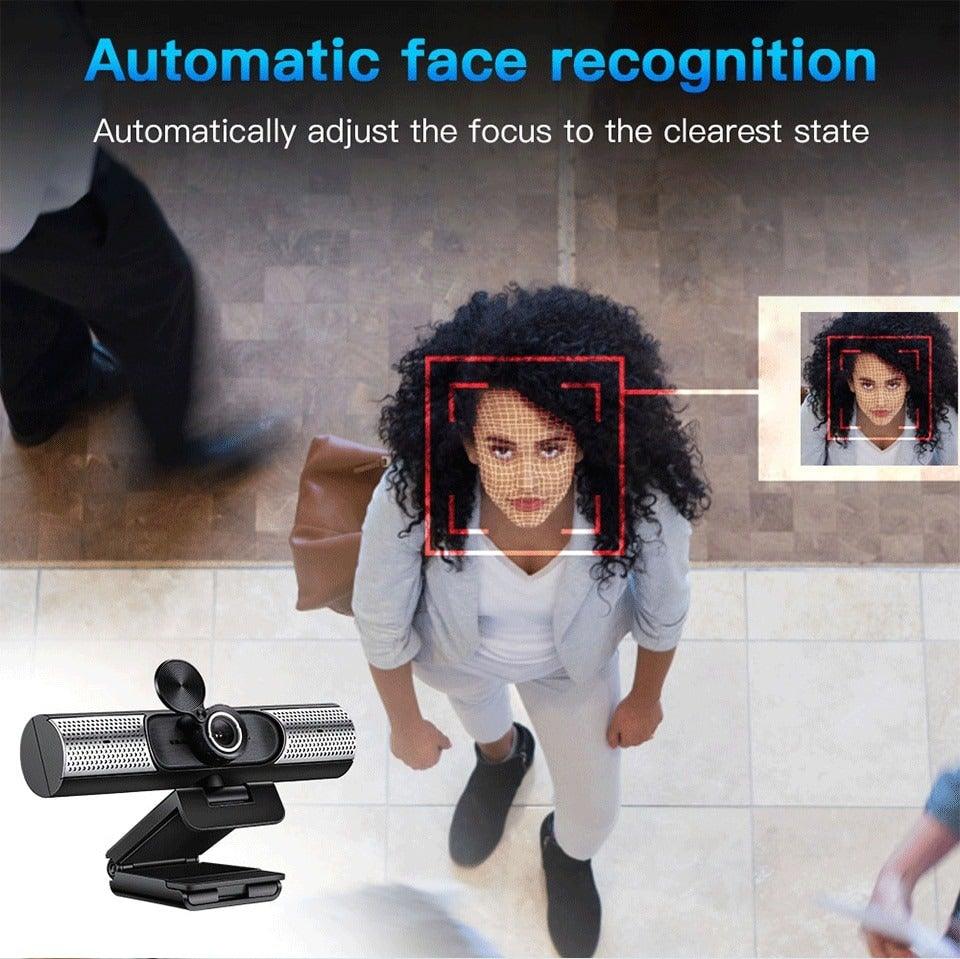Webcam with automatic face recognition feature in use, showing a person and a close-up inset.