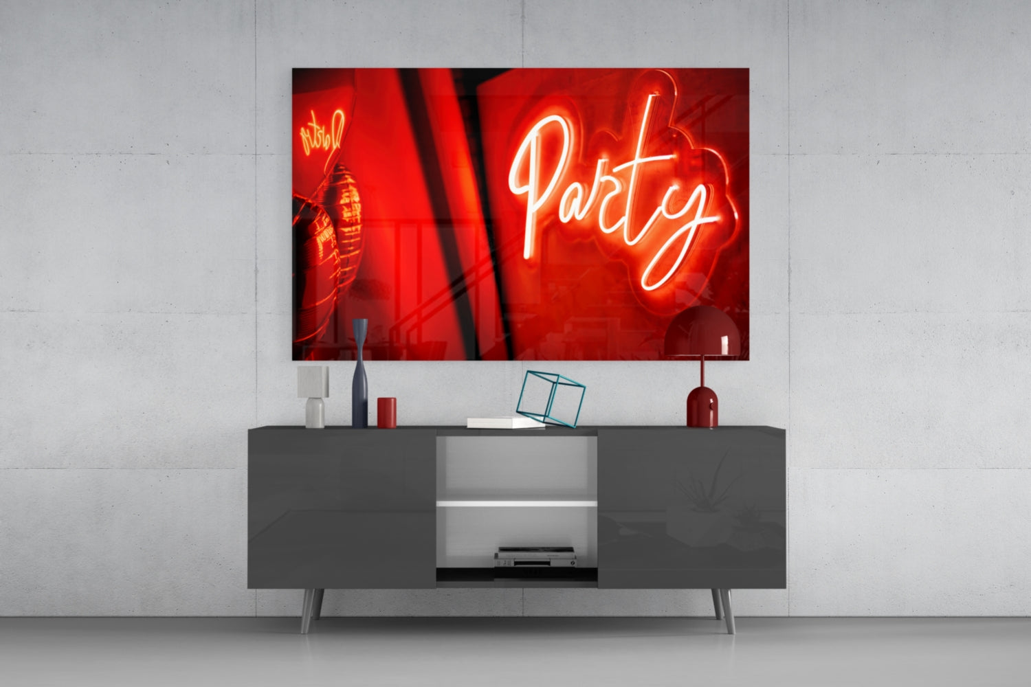Neon sign with 'Party' text on a wall above a modern cabinet.